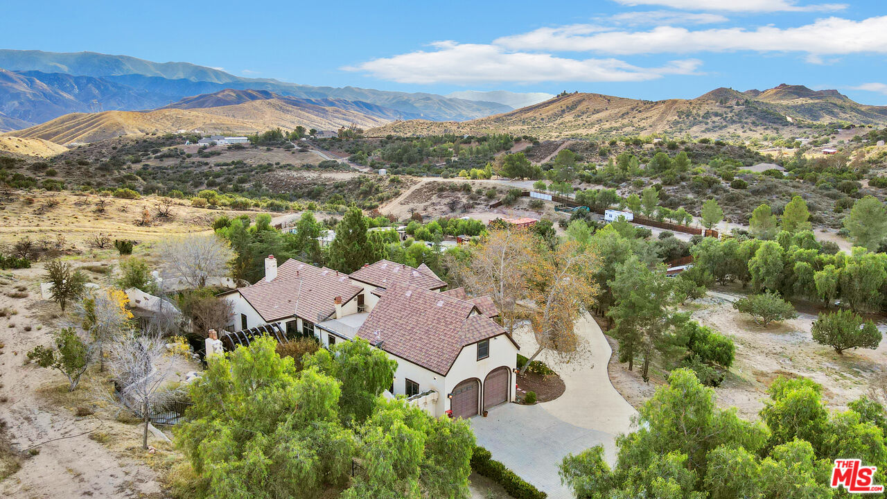 32140 Windrush Road Agua Dulce, CA 91390 - Photo 41 of 41 a view of a city with mountains in the background