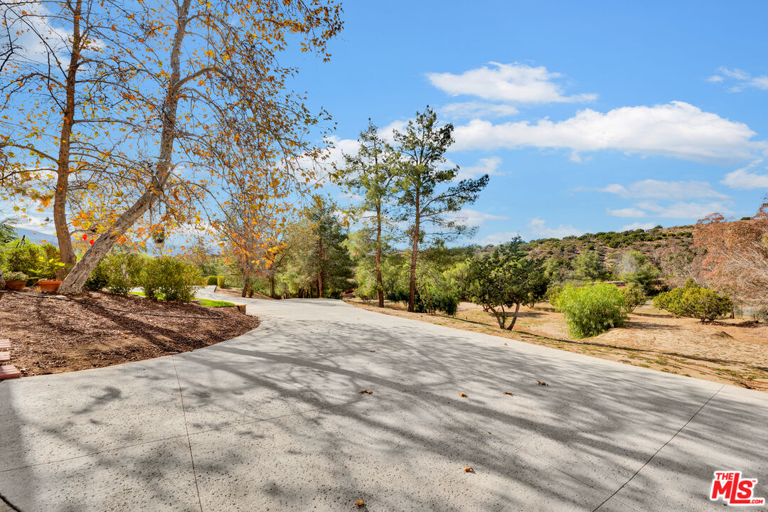 32140 Windrush Road Agua Dulce, CA 91390 - Photo 8 of 41 a view of a backyard of a house