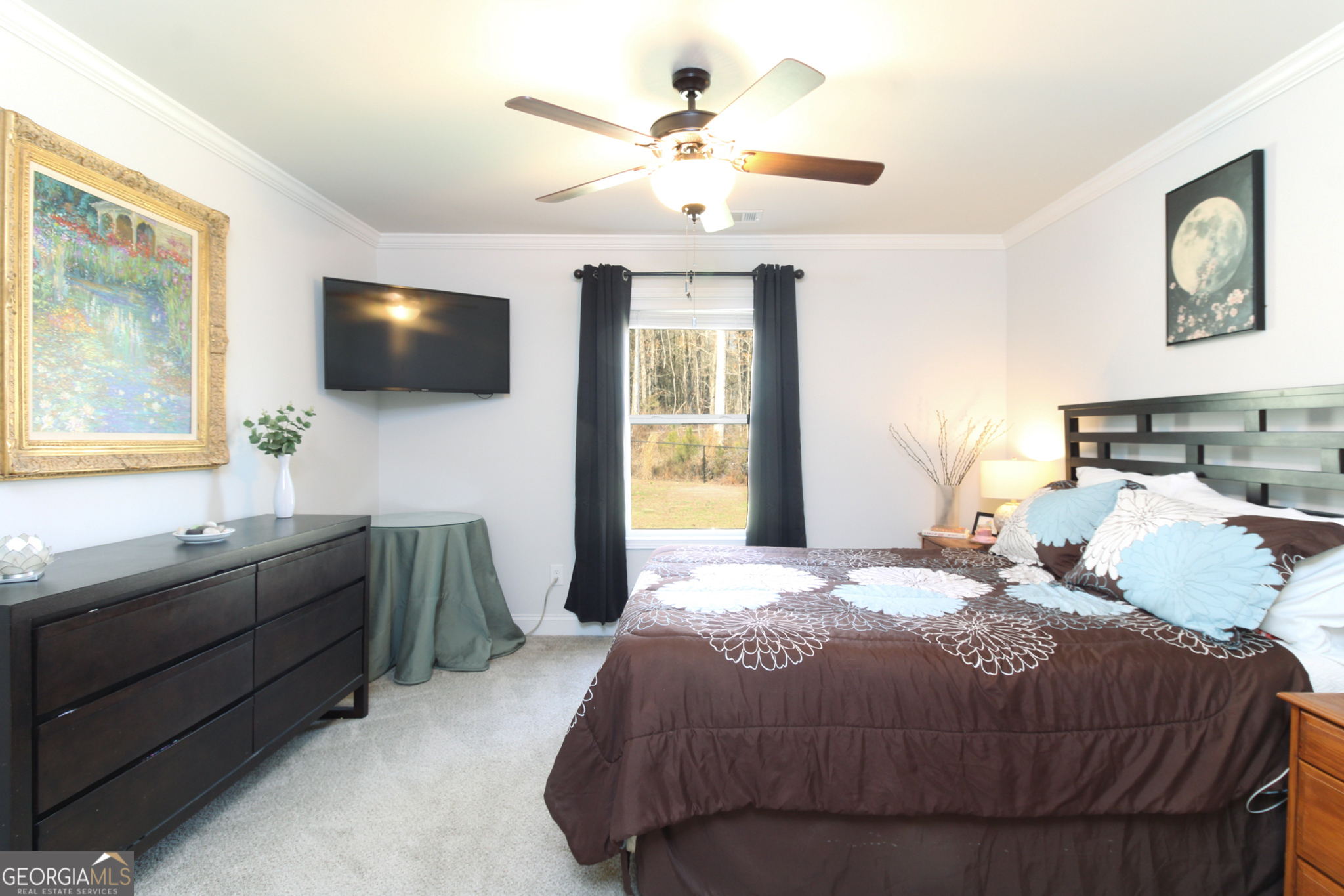 31 Rolling Woods Lane Colbert, GA 30628 - Photo 16 of 30 a bedroom with a large bed and a flat screen tv