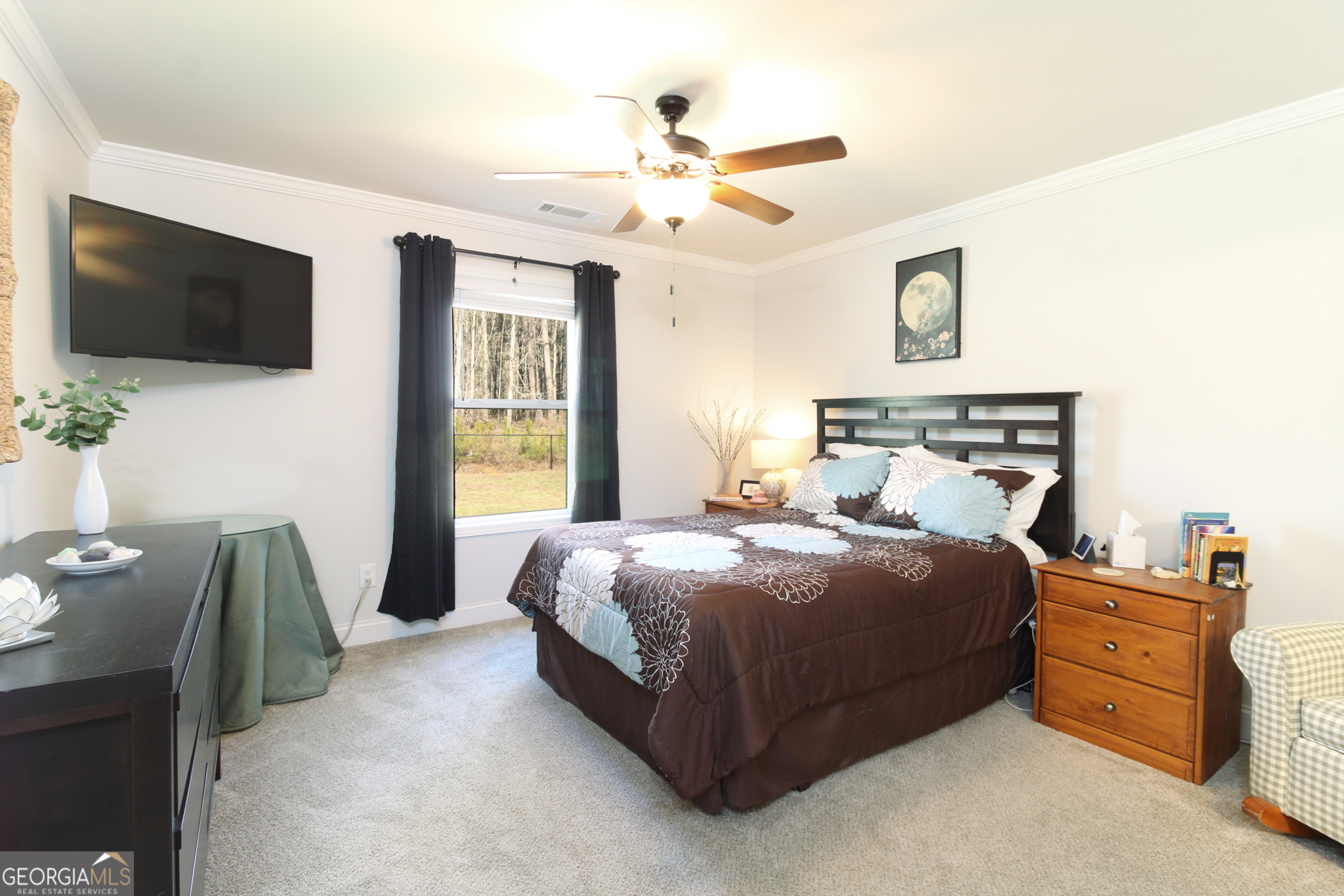 31 Rolling Woods Lane Colbert, GA 30628 - Photo 17 of 30 a bedroom with a bed and a flat screen tv