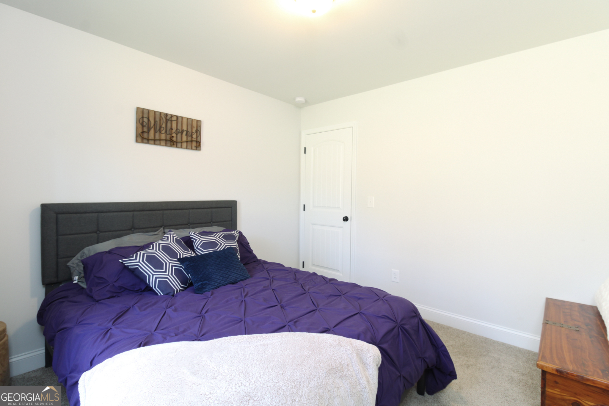 31 Rolling Woods Lane Colbert, GA 30628 - Photo 19 of 30 a bedroom with a bed and a chair