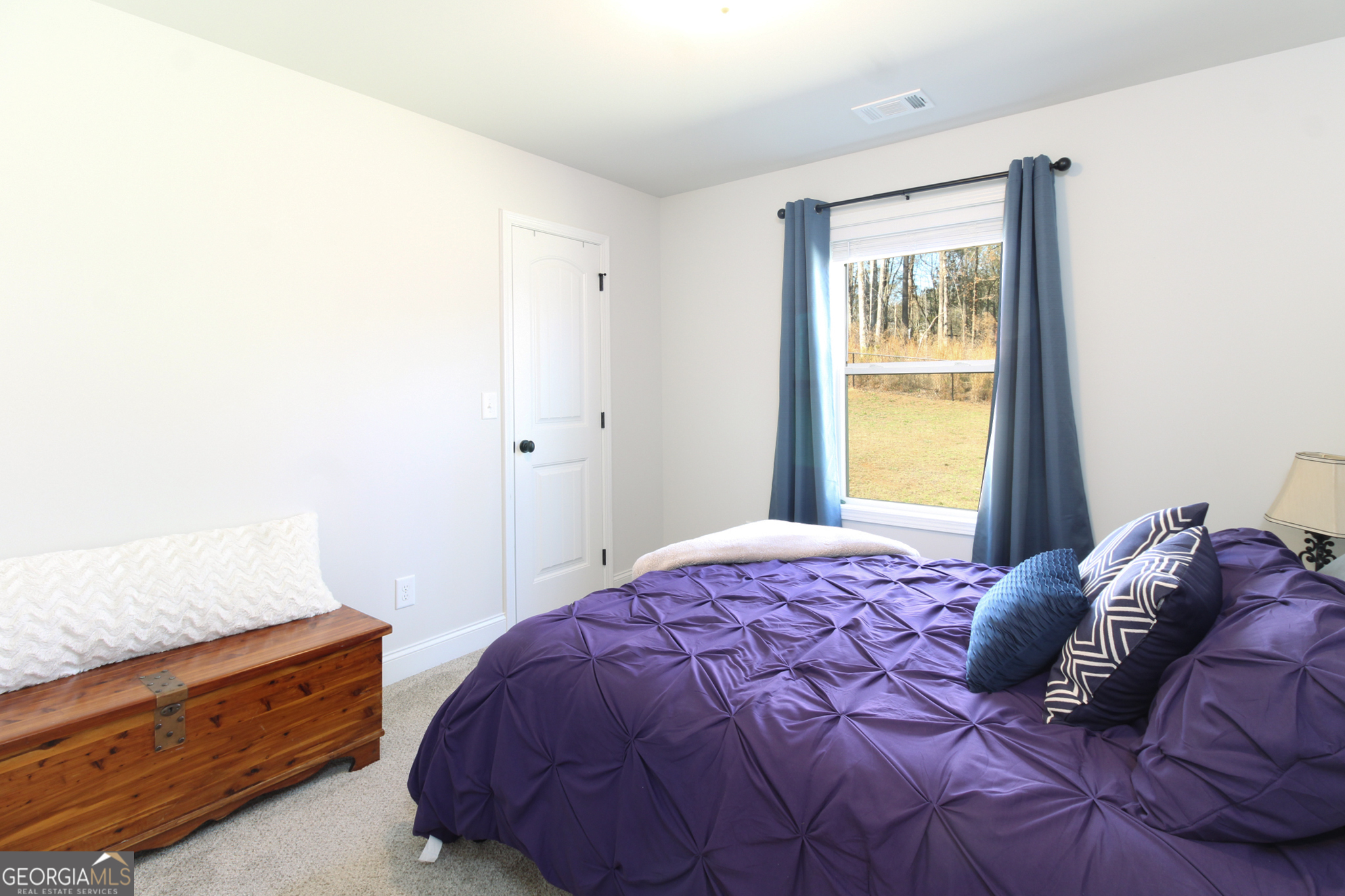 31 Rolling Woods Lane Colbert, GA 30628 - Photo 20 of 30 a bedroom with a bed and a window