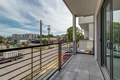 a view of a balcony with city view