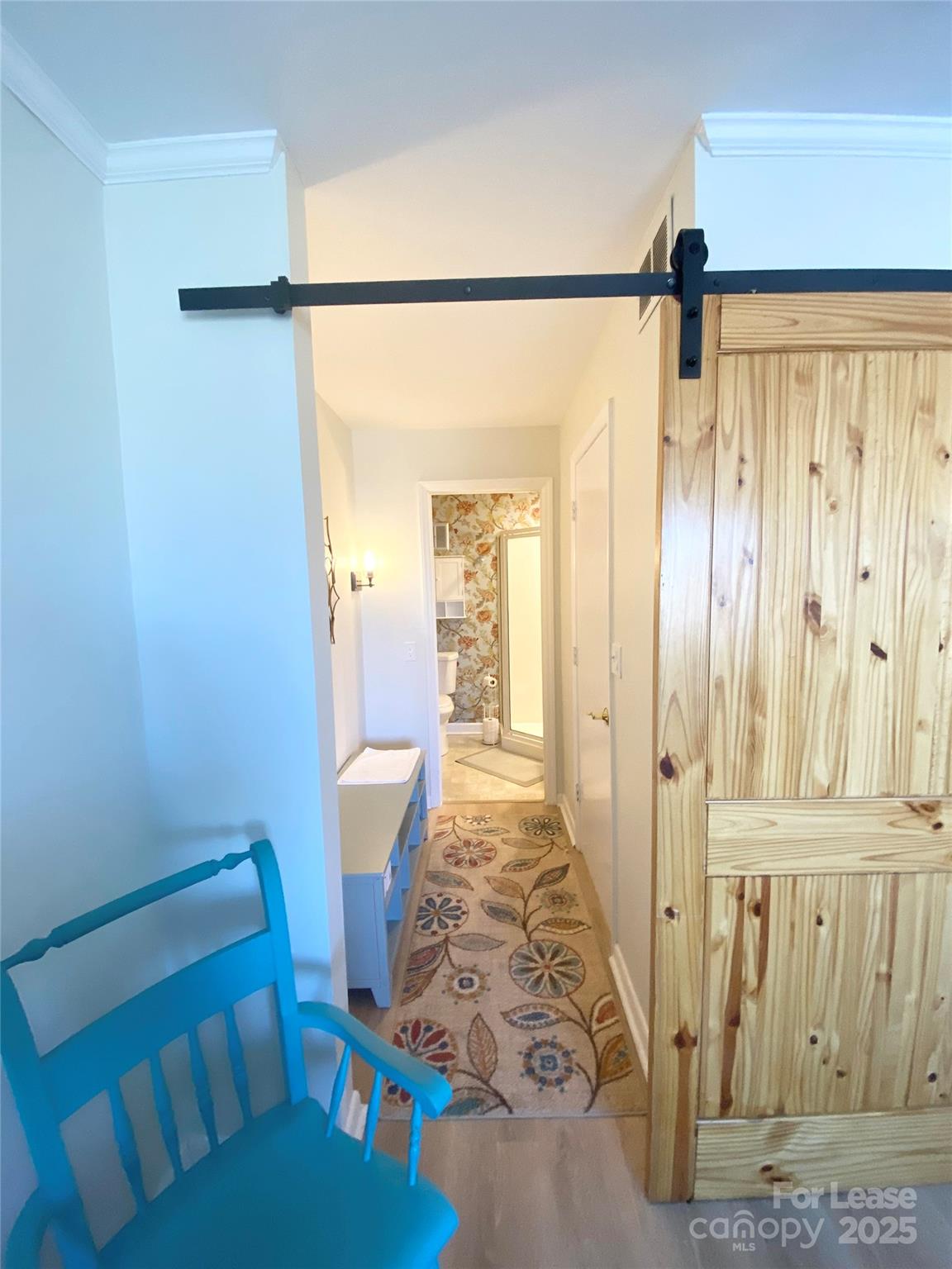 1323 Queens Road, Unit 322 Charlotte, NC 28207 - Photo 15 of 22 a view of a hallway with furniture and a window