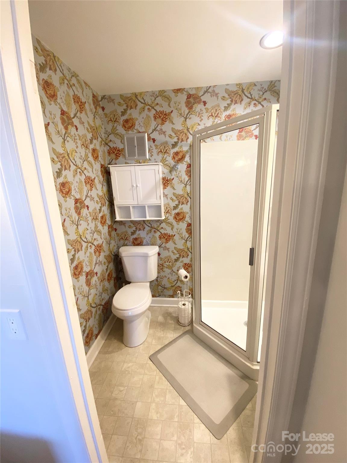 1323 Queens Road, Unit 322 Charlotte, NC 28207 - Photo 16 of 22 a bathroom with a toilet and a shower