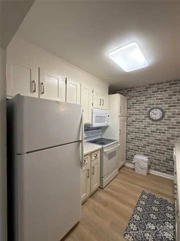 a spacious bathroom with a double vanity sink a mirror and a toilet