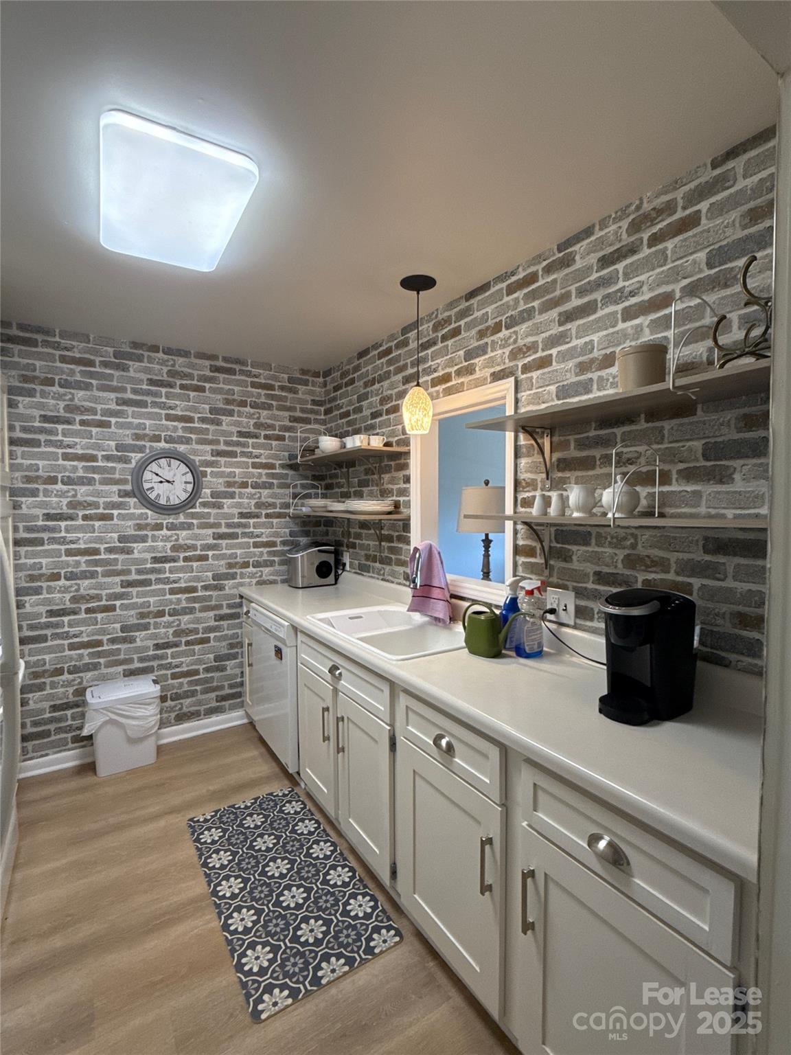 1323 Queens Road, Unit 322 Charlotte, NC 28207 - Photo 6 of 22 a spacious bathroom with a double vanity sink a mirror and a toilet