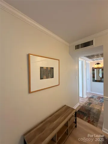 a bedroom with a bed a table and chair