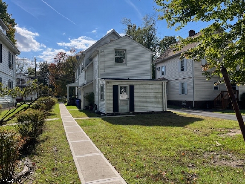 136 East Main Street, Unit 1 Little Falls, NJ 07424 - Photo 3 of 12 a front view of a house with a yard