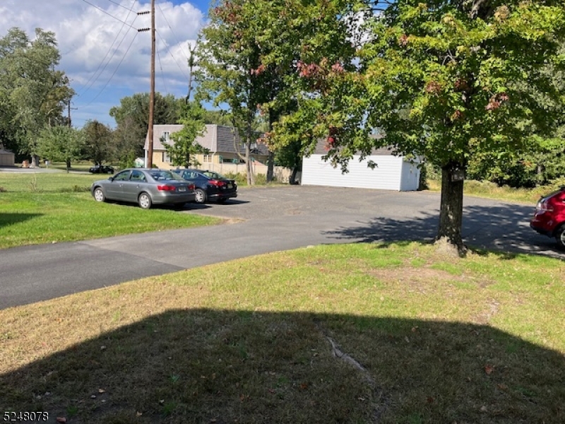 136 East Main Street, Unit 1 Little Falls, NJ 07424 - Photo 4 of 12 a view of a street with a car parked on the side of the road