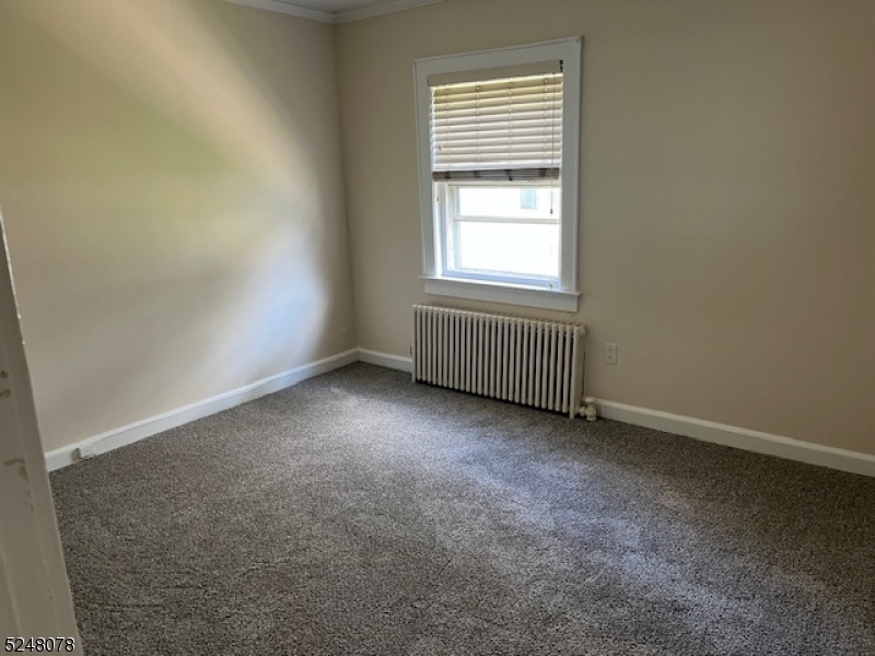 136 East Main Street, Unit 1 Little Falls, NJ 07424 - Photo 7 of 12 an empty room with a window
