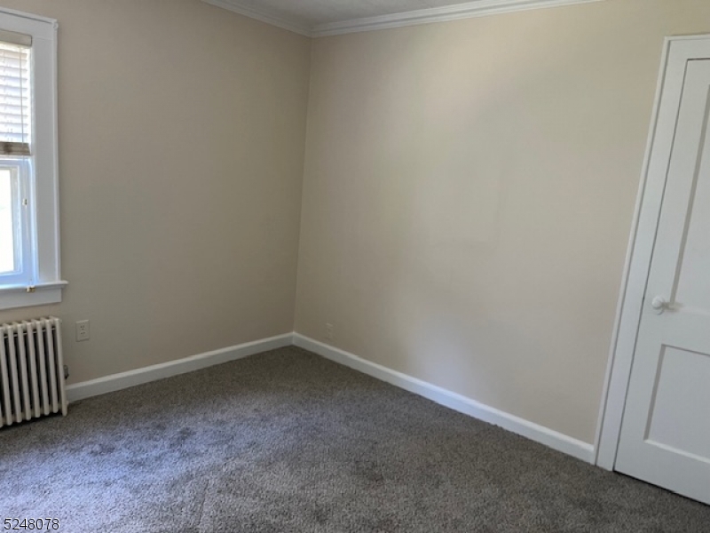 136 East Main Street, Unit 1 Little Falls, NJ 07424 - Photo 8 of 12 an empty room with a window
