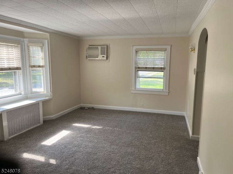 136 East Main Street, Unit 1 Little Falls, NJ 07424 - Photo 9 of 12 an empty room with windows