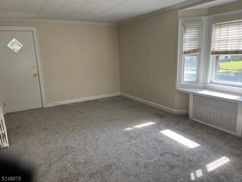 136 East Main Street, Unit 1 Little Falls, NJ 07424 - Photo 10 of 12 an empty room with windows