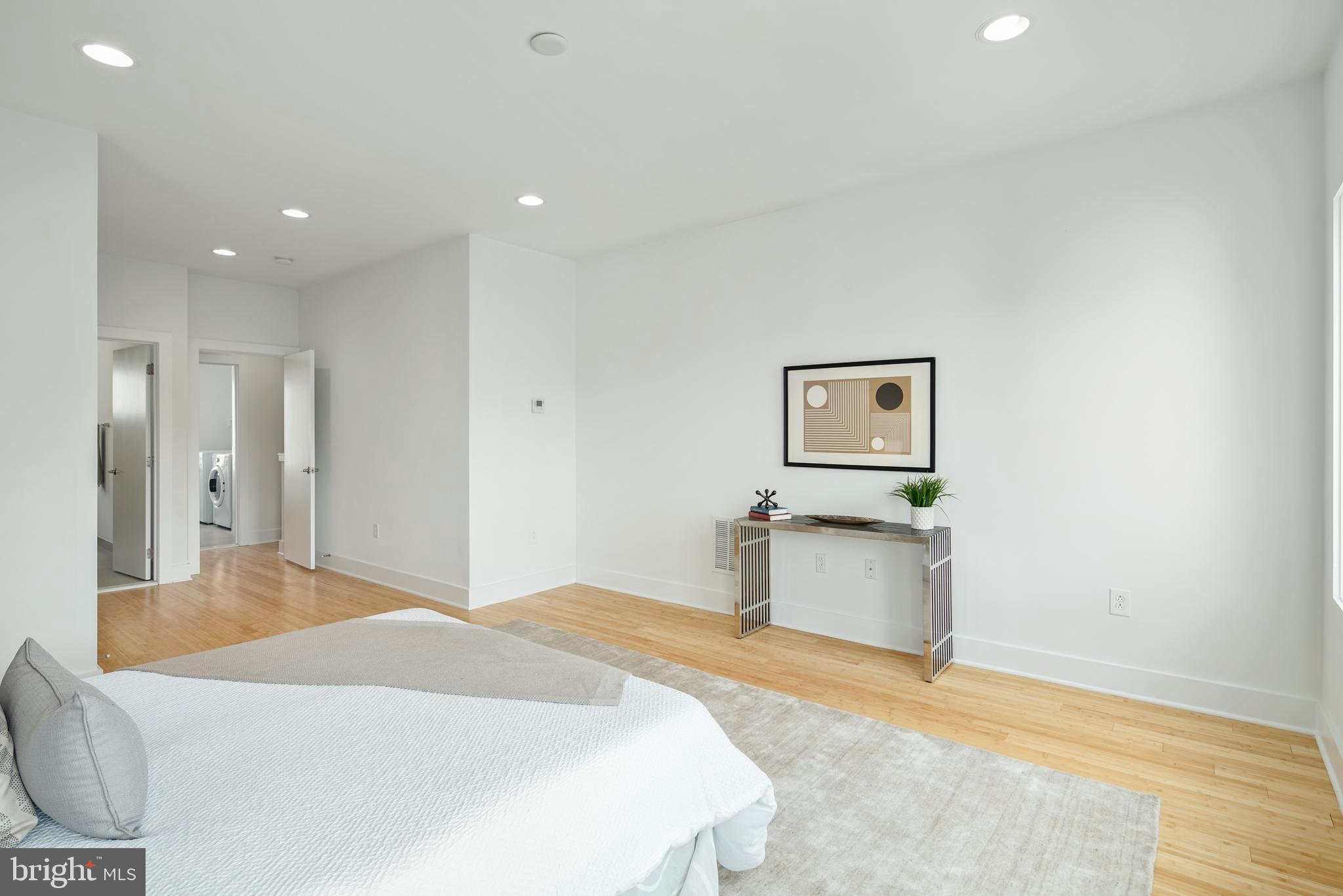1135 Hope Street, Unit 18 Philadelphia, PA 19123 - Photo 12 of 21 a bedroom with a bed and painting on the wall