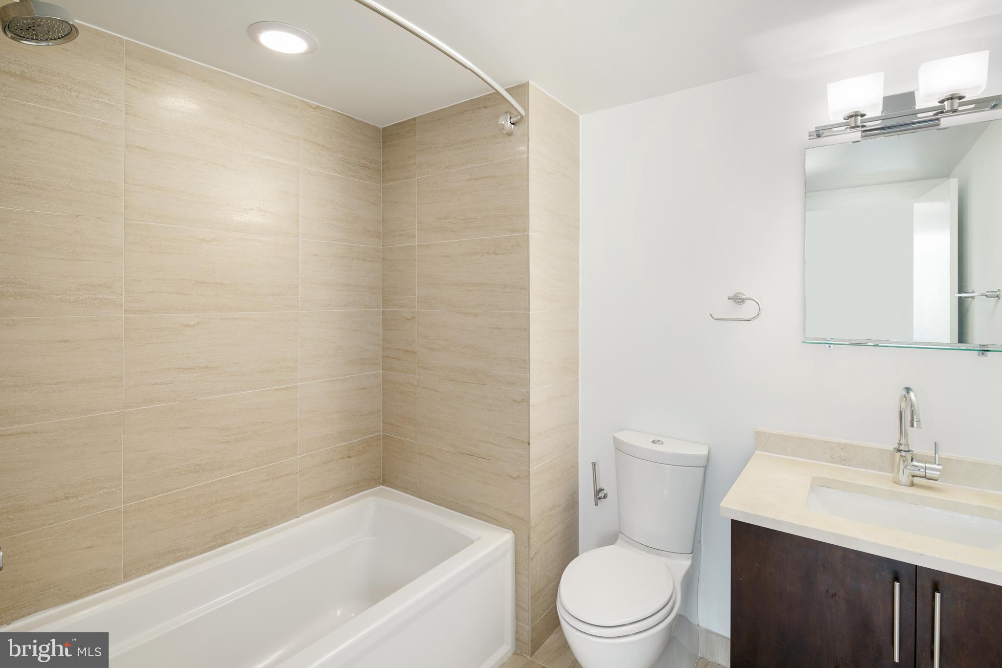 1135 Hope Street, Unit 18 Philadelphia, PA 19123 - Photo 19 of 21 a bathroom with a sink a toilet and shower