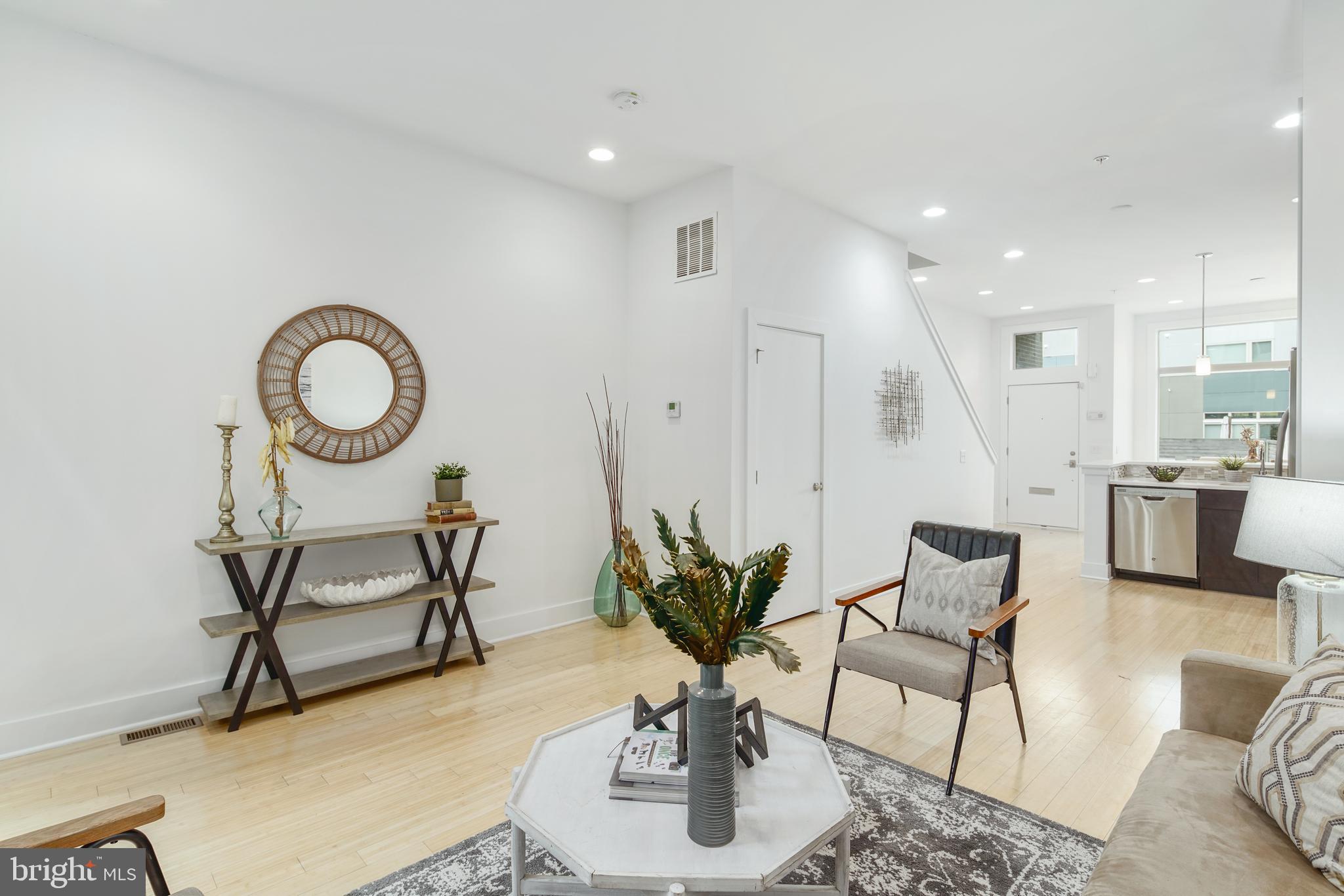 1135 Hope Street, Unit 18 Philadelphia, PA 19123 - Photo 5 of 21 a view of a livingroom with furniture and a potted plant