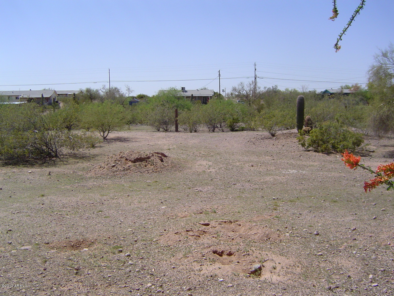 642 South Hilton Road Apache Junction, AZ 85119 - Photo 3 of 9 a view of a road with a building in the background