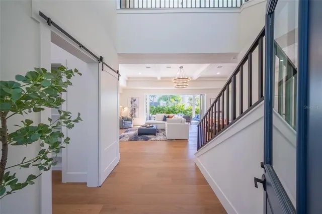 a dining room with furniture window and wooden floor