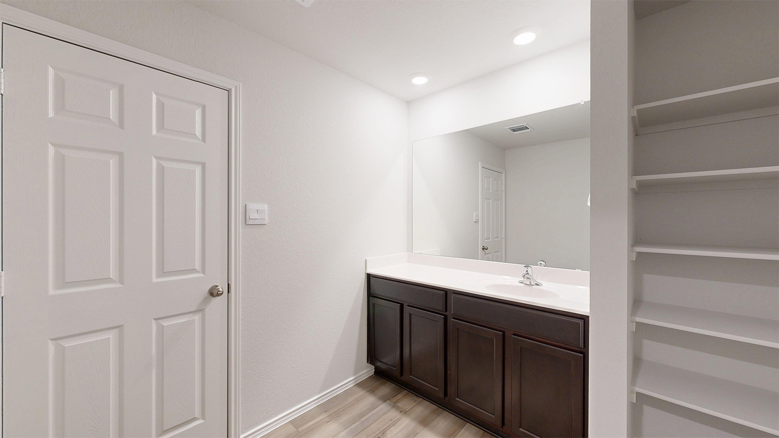 160 McNamara Court Jarrell, TX 76537 - Photo 9 of 27 a bathroom with a double vanity sink and a mirror
