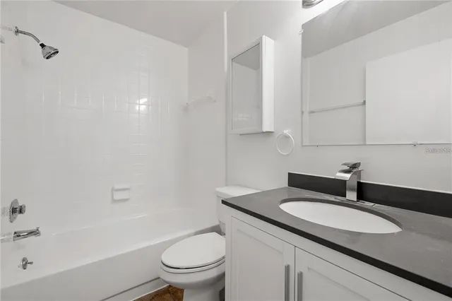 a view of a small pool with a yard