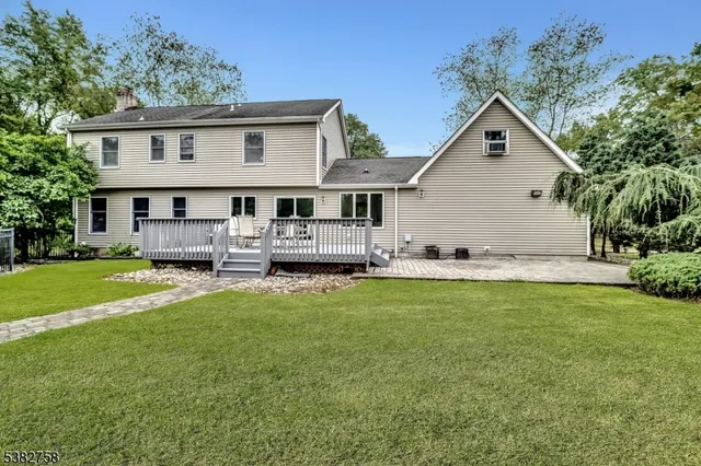 a view of house with outdoor space and garden