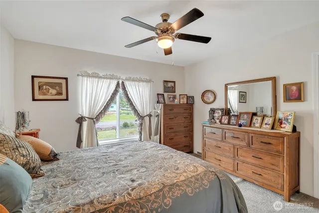 a view of hallway with furniture and a potted plant