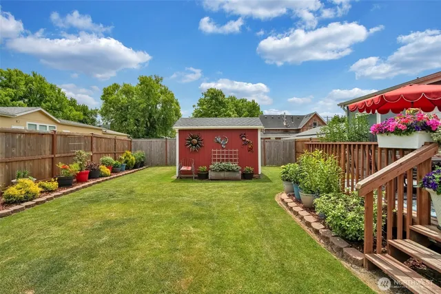 an outdoor sitting area with an umbrella