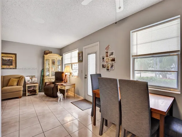a work room with furniture and a window