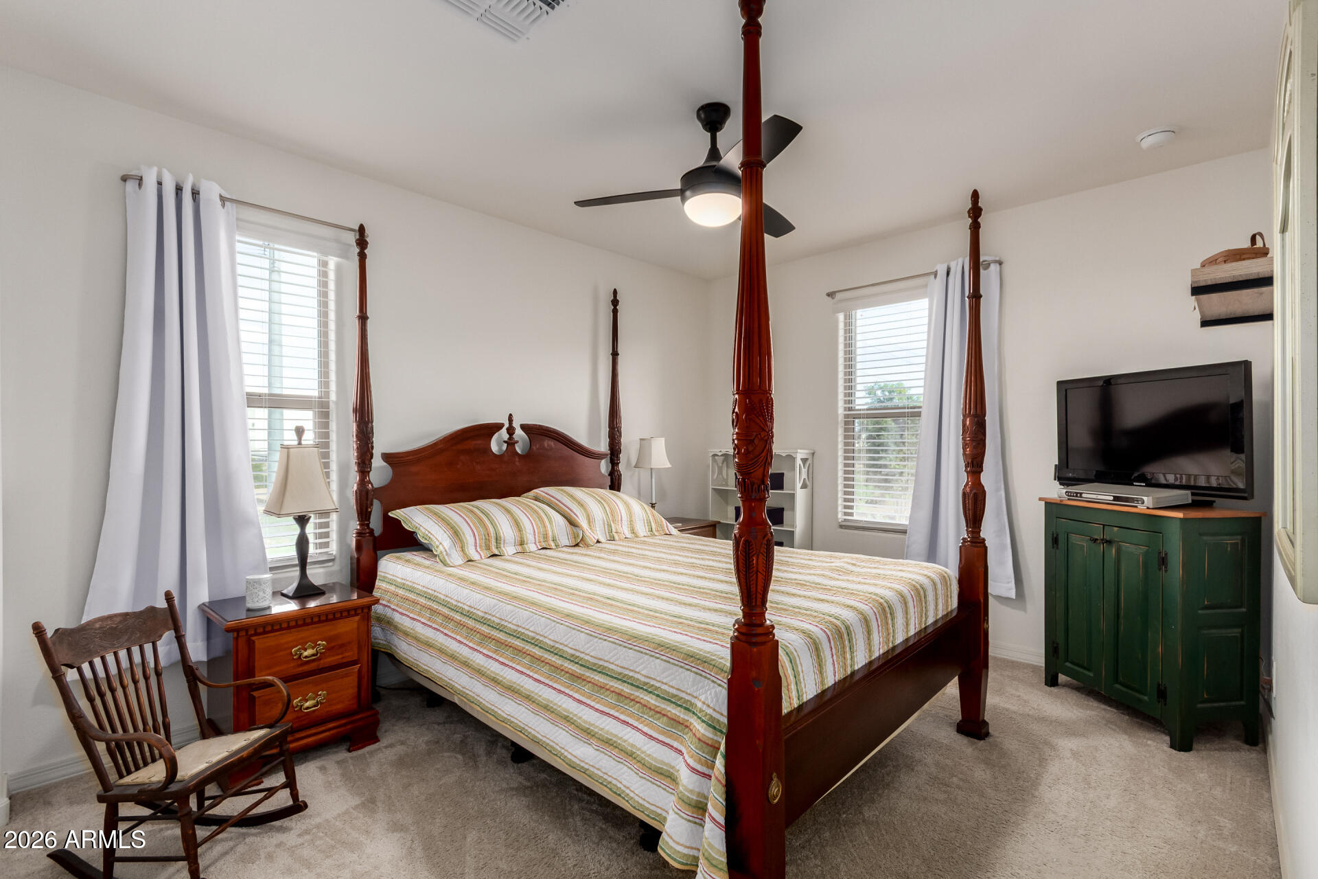 5740 West Raymond Street Phoenix, AZ 85043 - Photo 19 of 41 a bedroom with a bed and a television