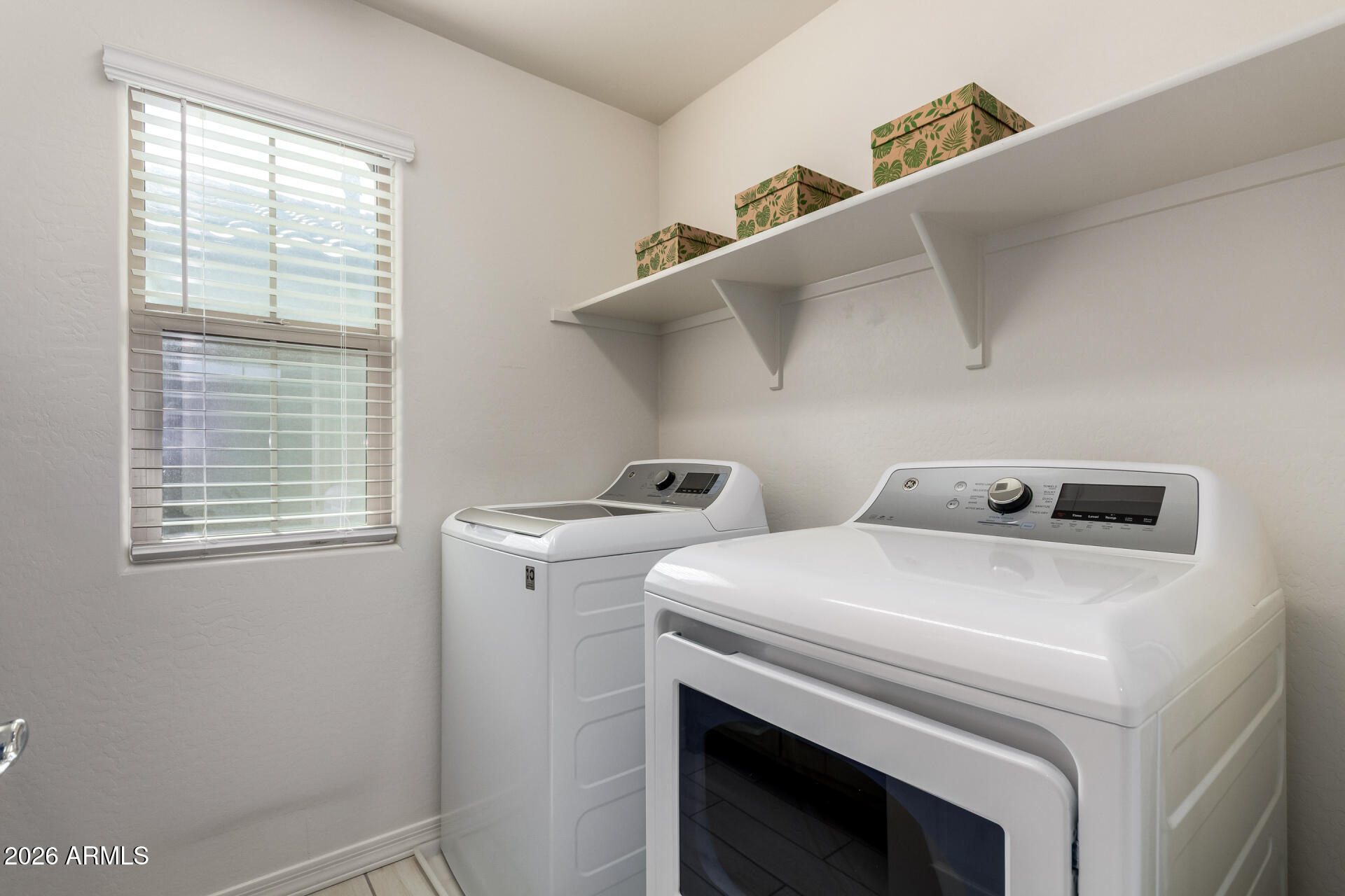 5740 West Raymond Street Phoenix, AZ 85043 - Photo 20 of 41 a utility room with dryer and washer