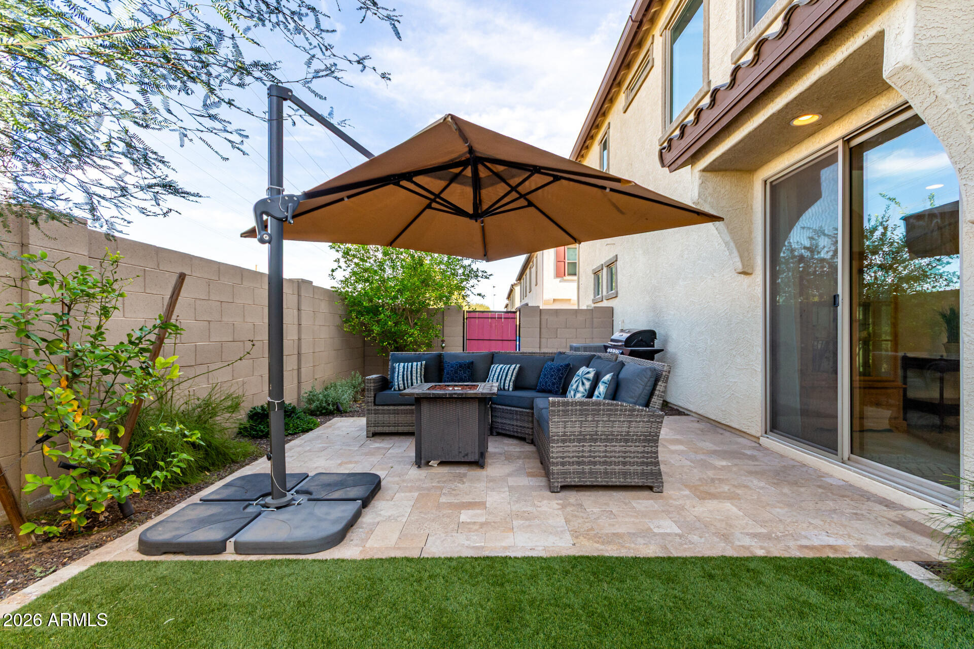 5740 West Raymond Street Phoenix, AZ 85043 - Photo 26 of 41 a view of backyard with outdoor seating and plants