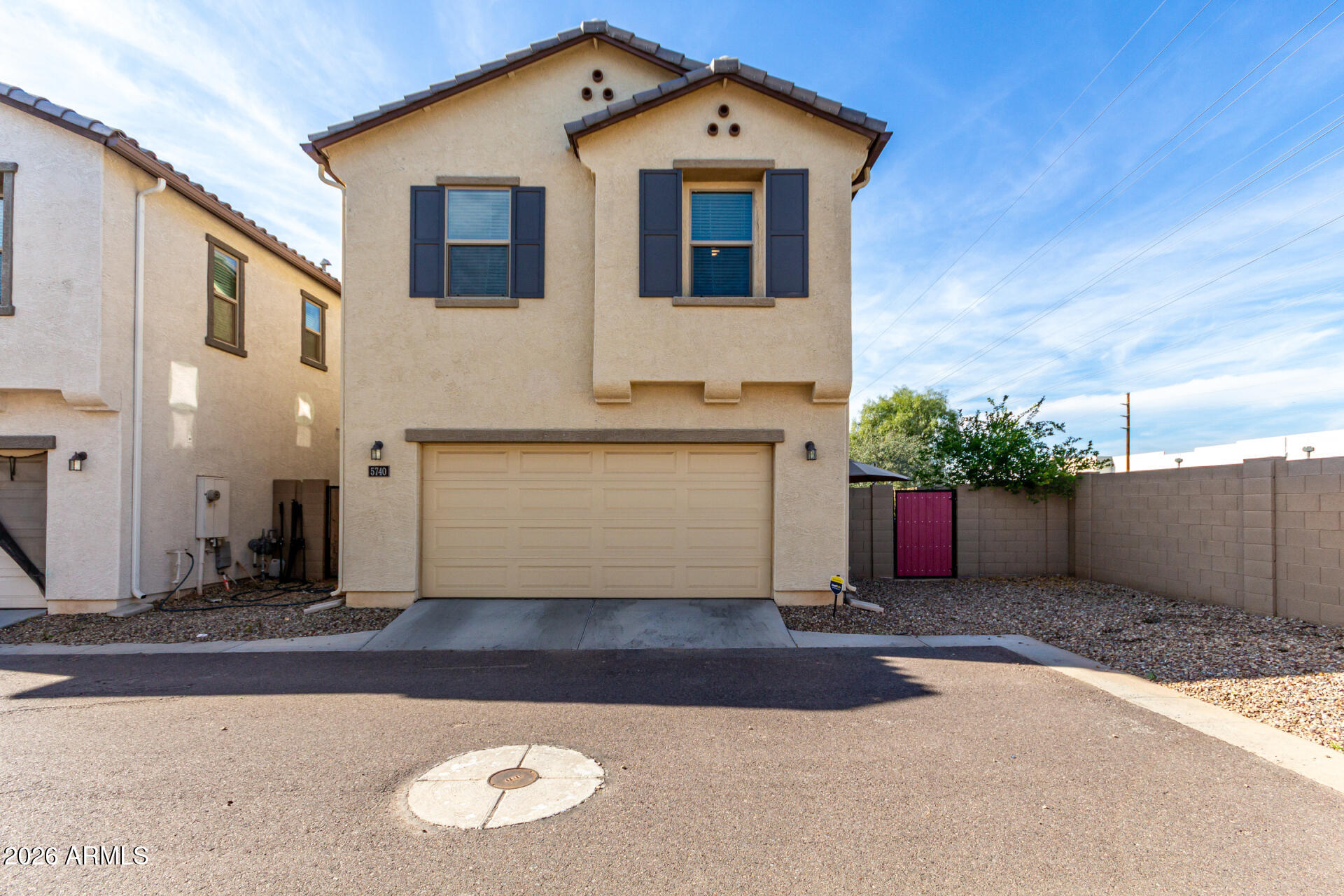 5740 West Raymond Street Phoenix, AZ 85043 - Photo 31 of 41 a view of a house with a yard