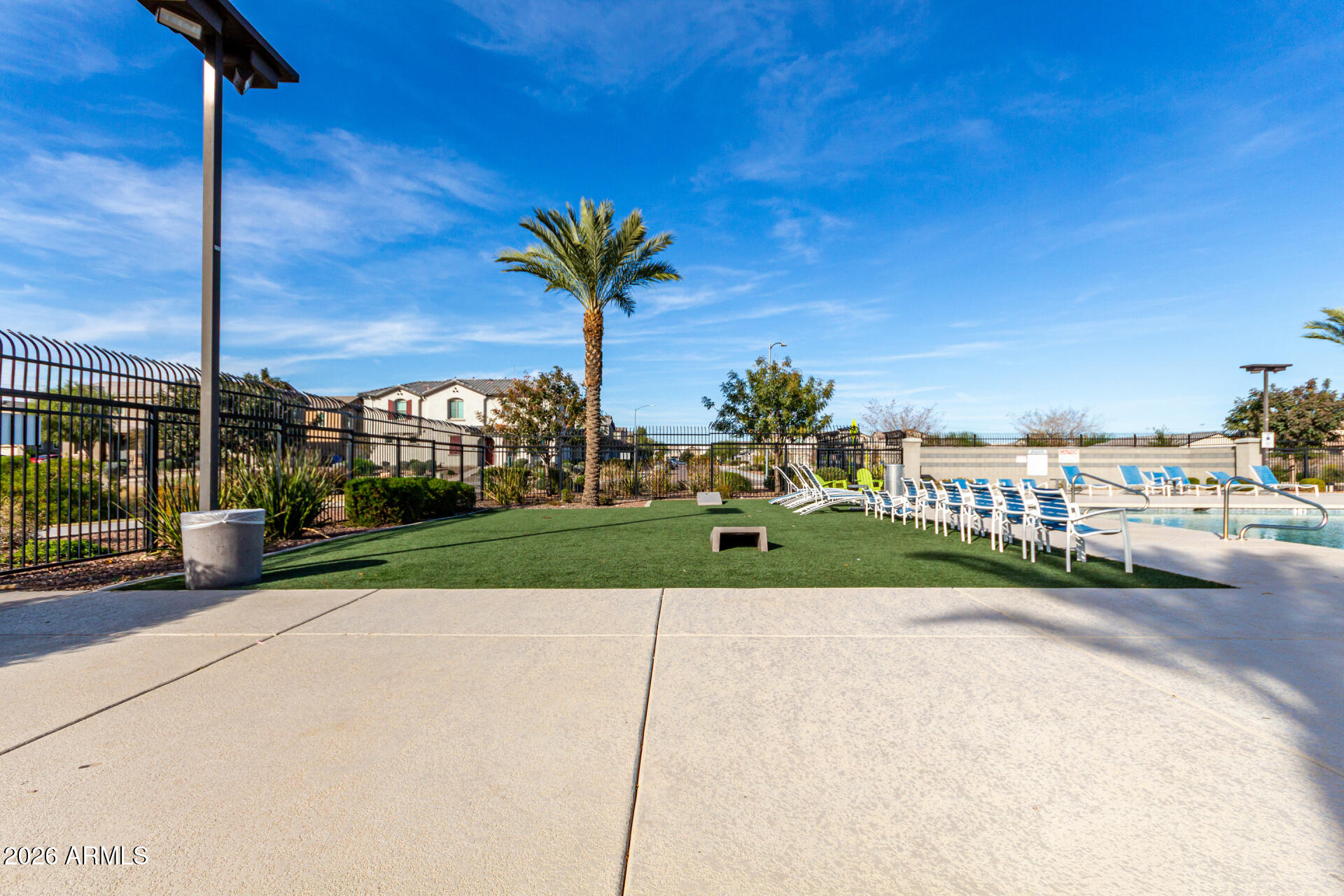 5740 West Raymond Street Phoenix, AZ 85043 - Photo 36 of 41 a front view of a house with a yard and table and chairs