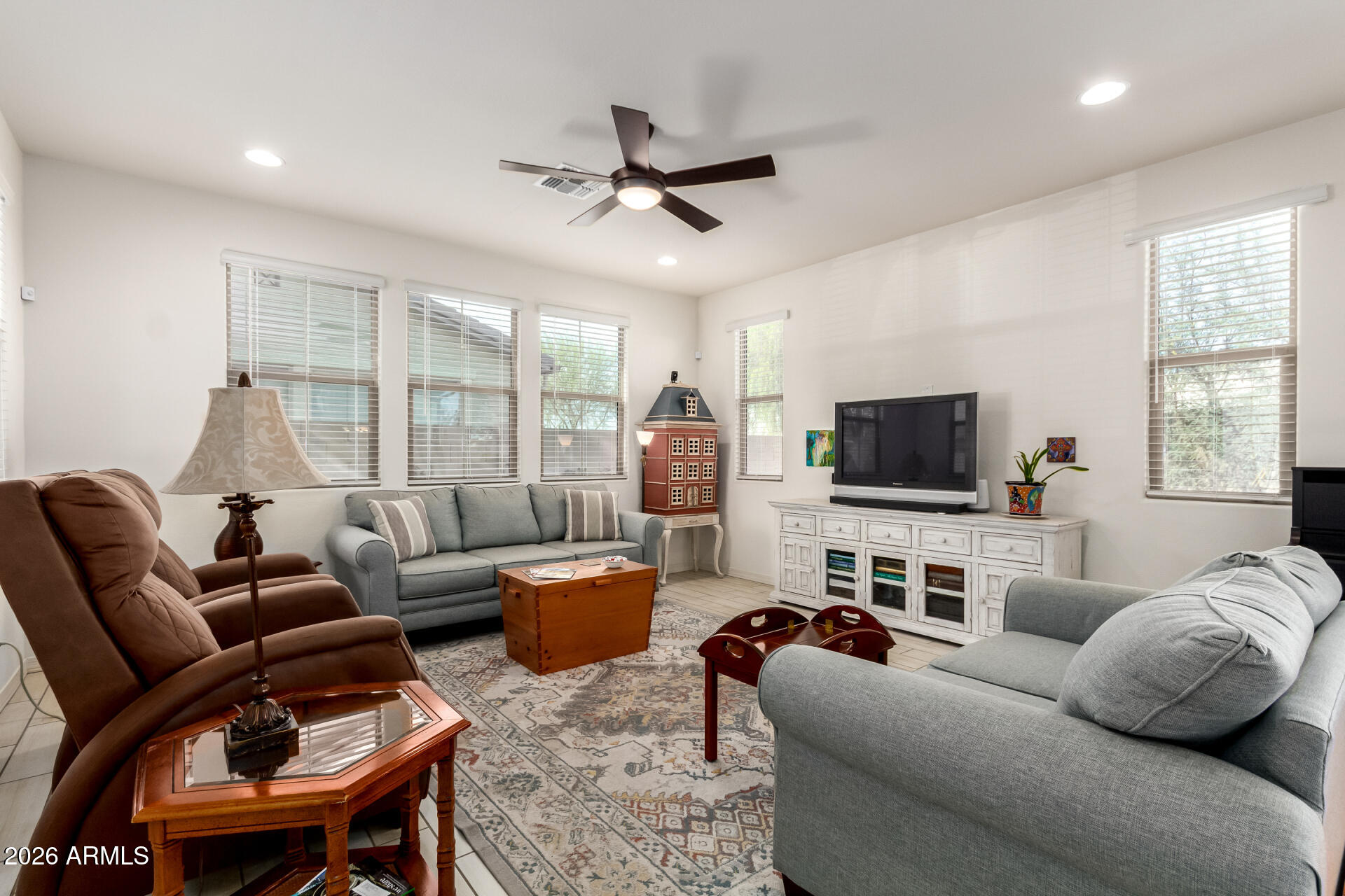5740 West Raymond Street Phoenix, AZ 85043 - Photo 4 of 41 a living room with furniture and a flat screen tv