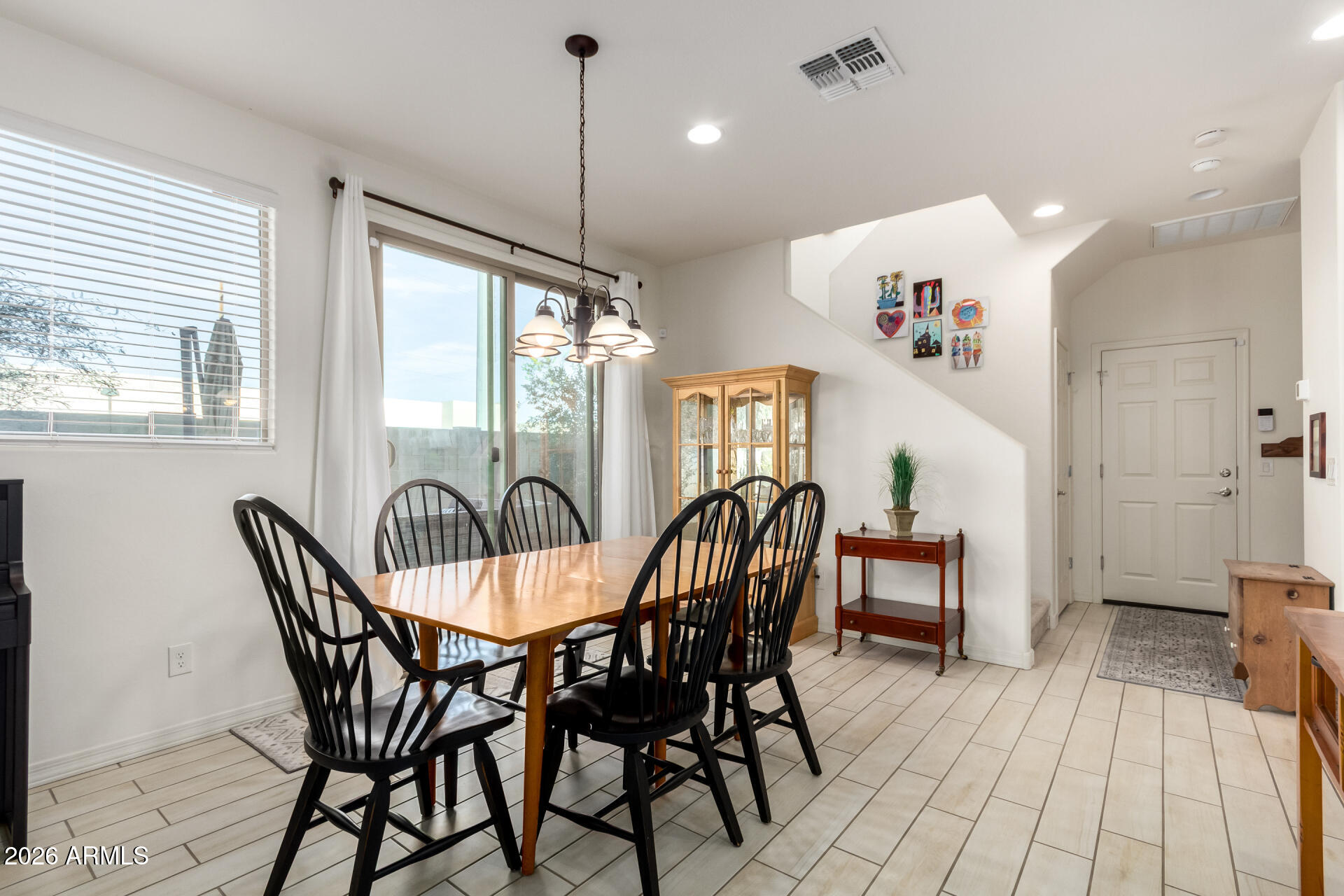 5740 West Raymond Street Phoenix, AZ 85043 - Photo 10 of 41 a view of a dining room with furniture window and outside view