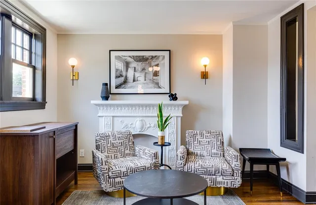 a living room with furniture and a fireplace