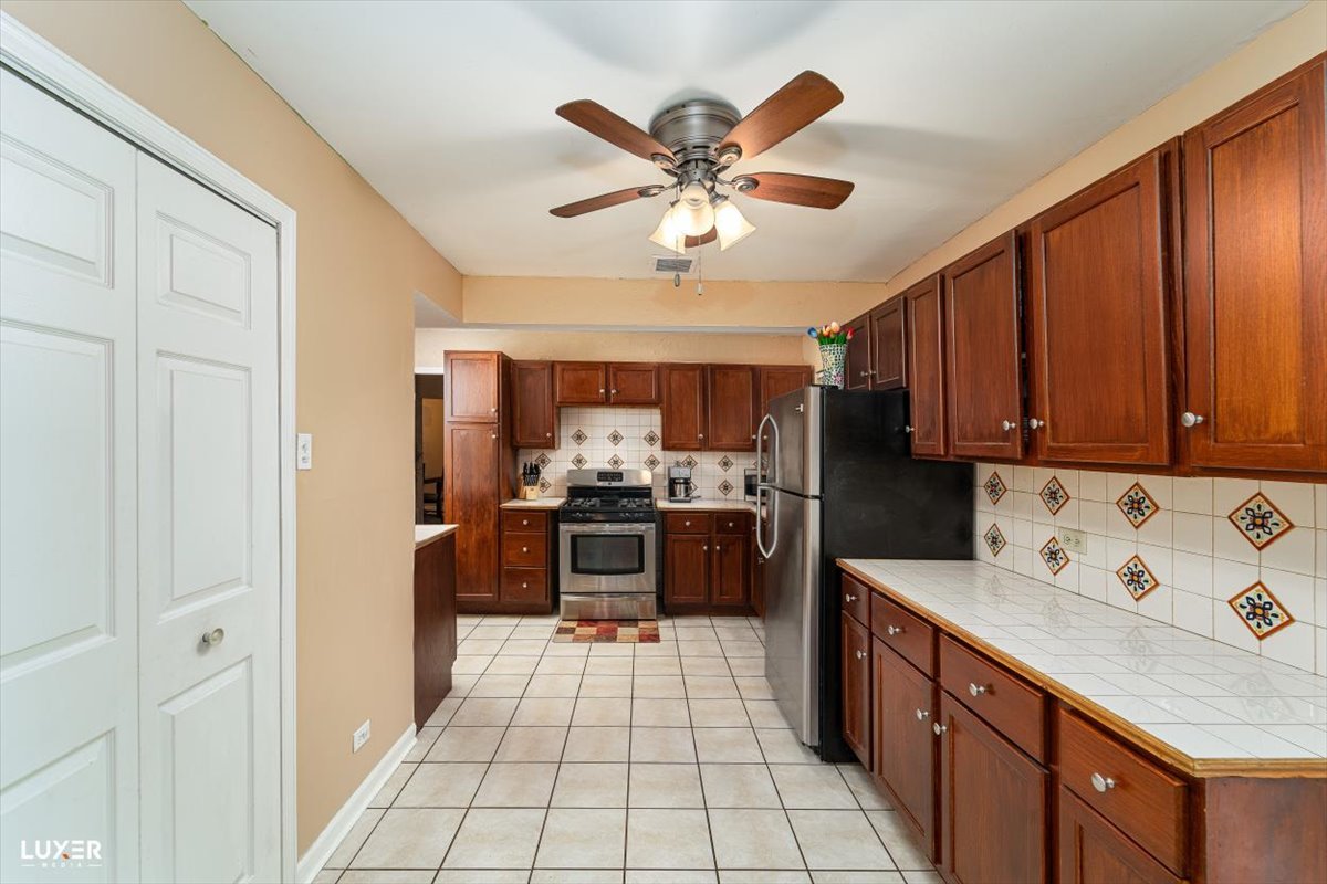 4448 Adele Lane Oak Forest, IL 60452 - Photo 12 of 28 a kitchen with a cabinets and appliances