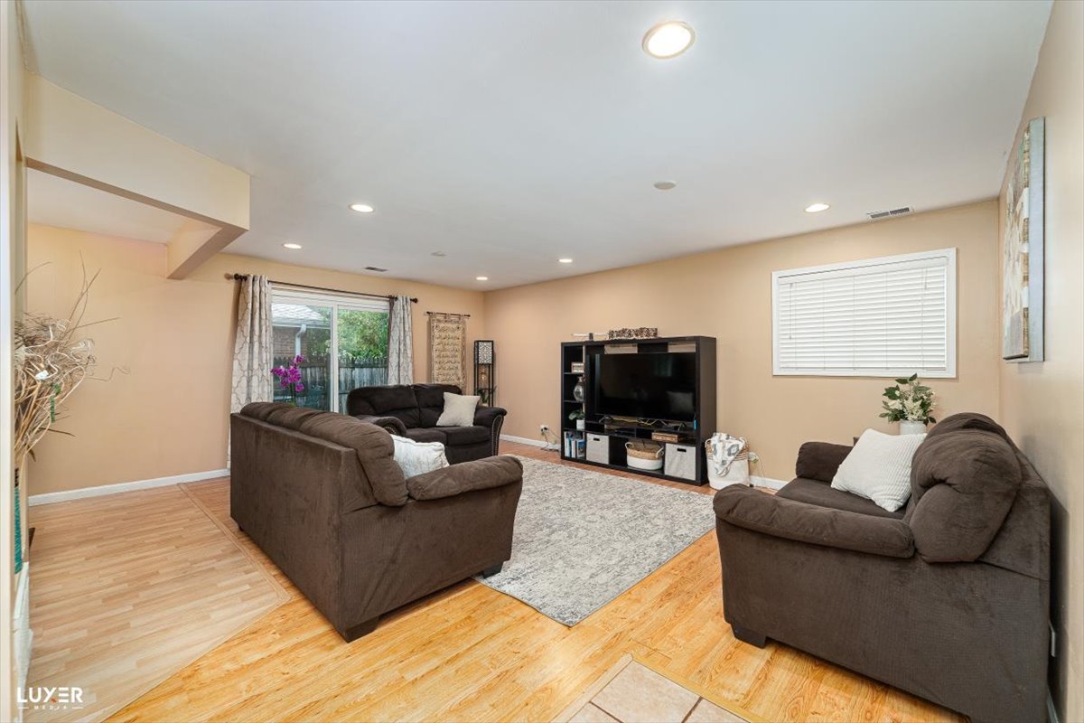4448 Adele Lane Oak Forest, IL 60452 - Photo 6 of 28 a living room with furniture and a flat screen tv