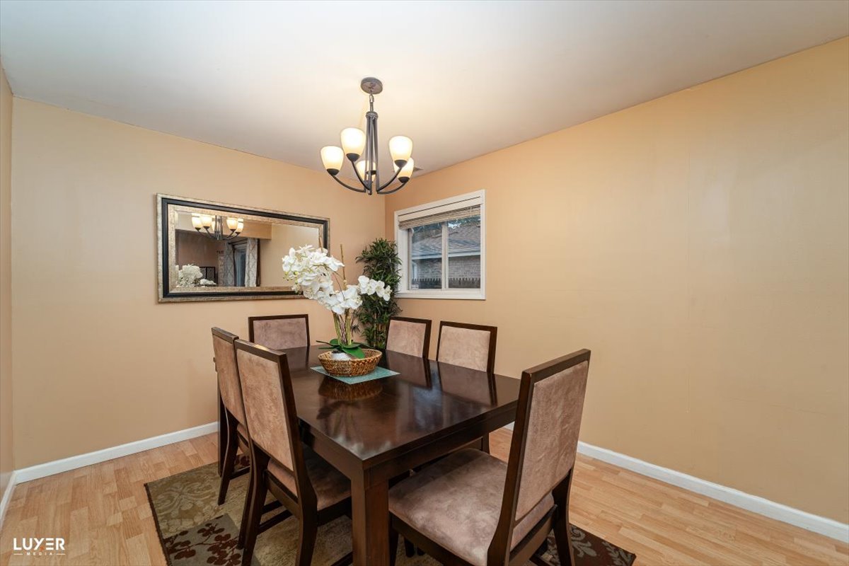 4448 Adele Lane Oak Forest, IL 60452 - Photo 10 of 28 a view of a dining room with furniture and wooden floor