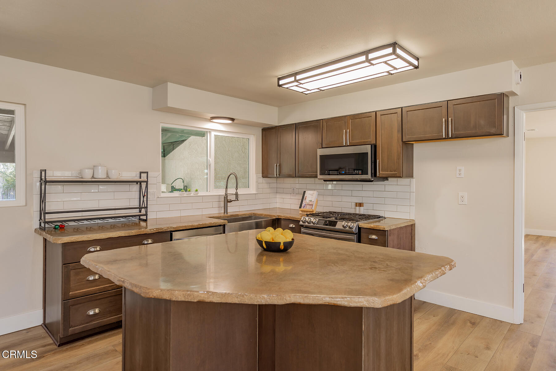 165 Burnham Road Oak View, CA 93022 - Photo 14 of 58 a kitchen with stainless steel appliances granite countertop a sink a stove and microwave