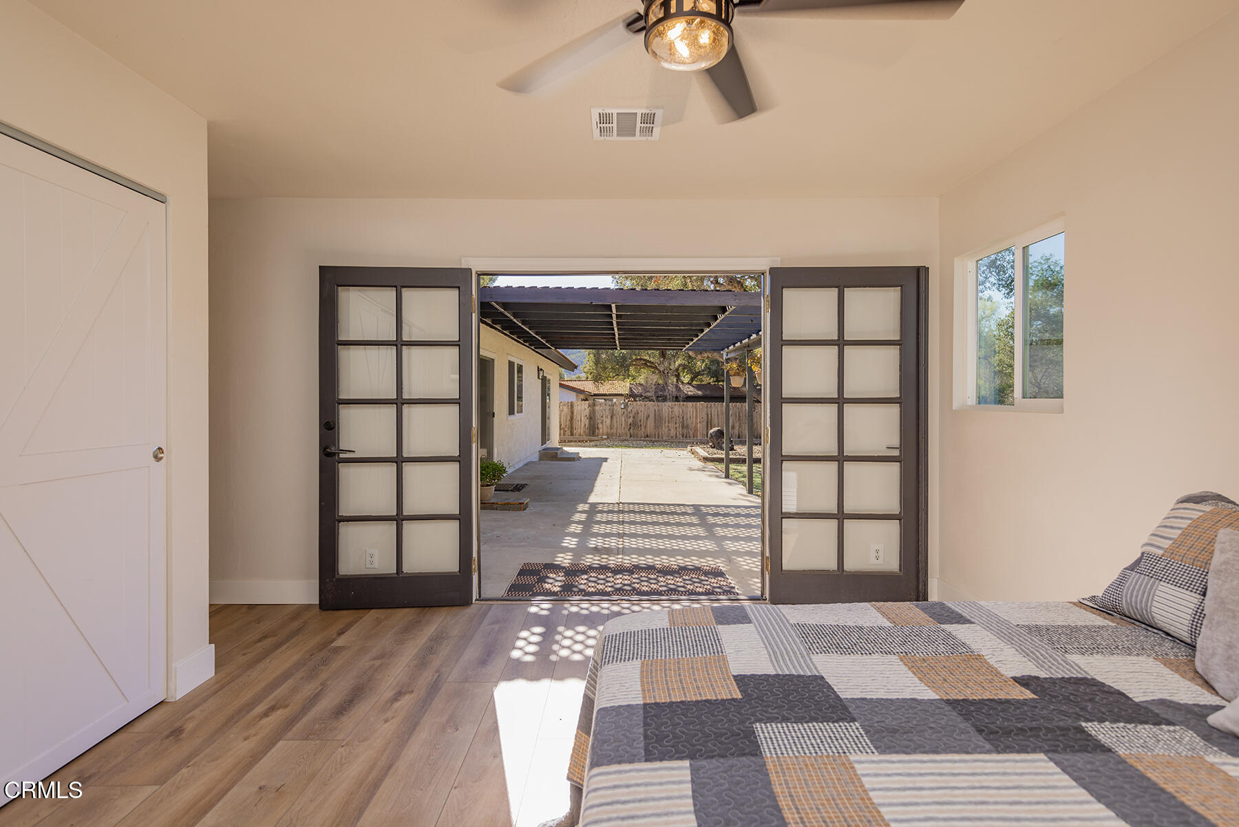 165 Burnham Road Oak View, CA 93022 - Photo 21 of 58 a bedroom with a bed and a window