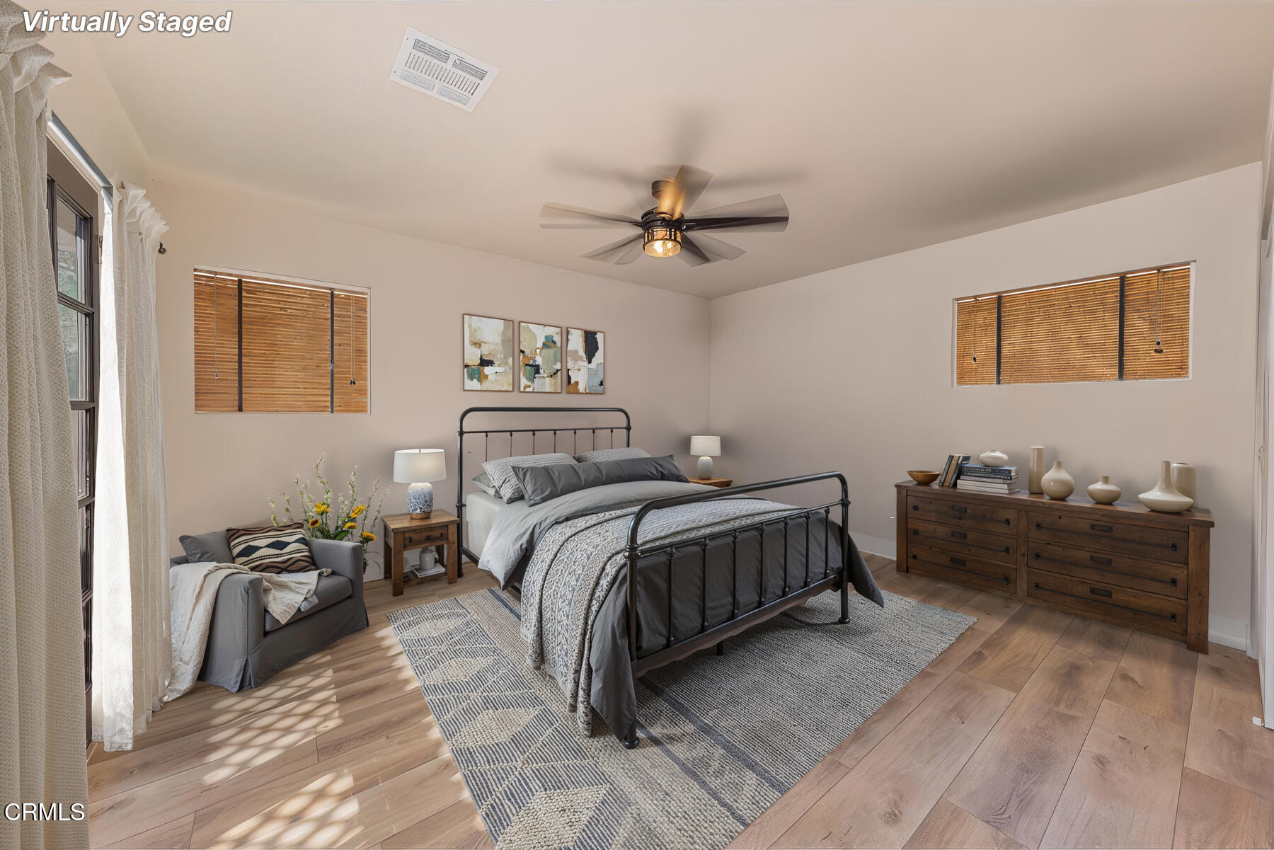 165 Burnham Road Oak View, CA 93022 - Photo 23 of 58 a bedroom with a bed and a chandelier