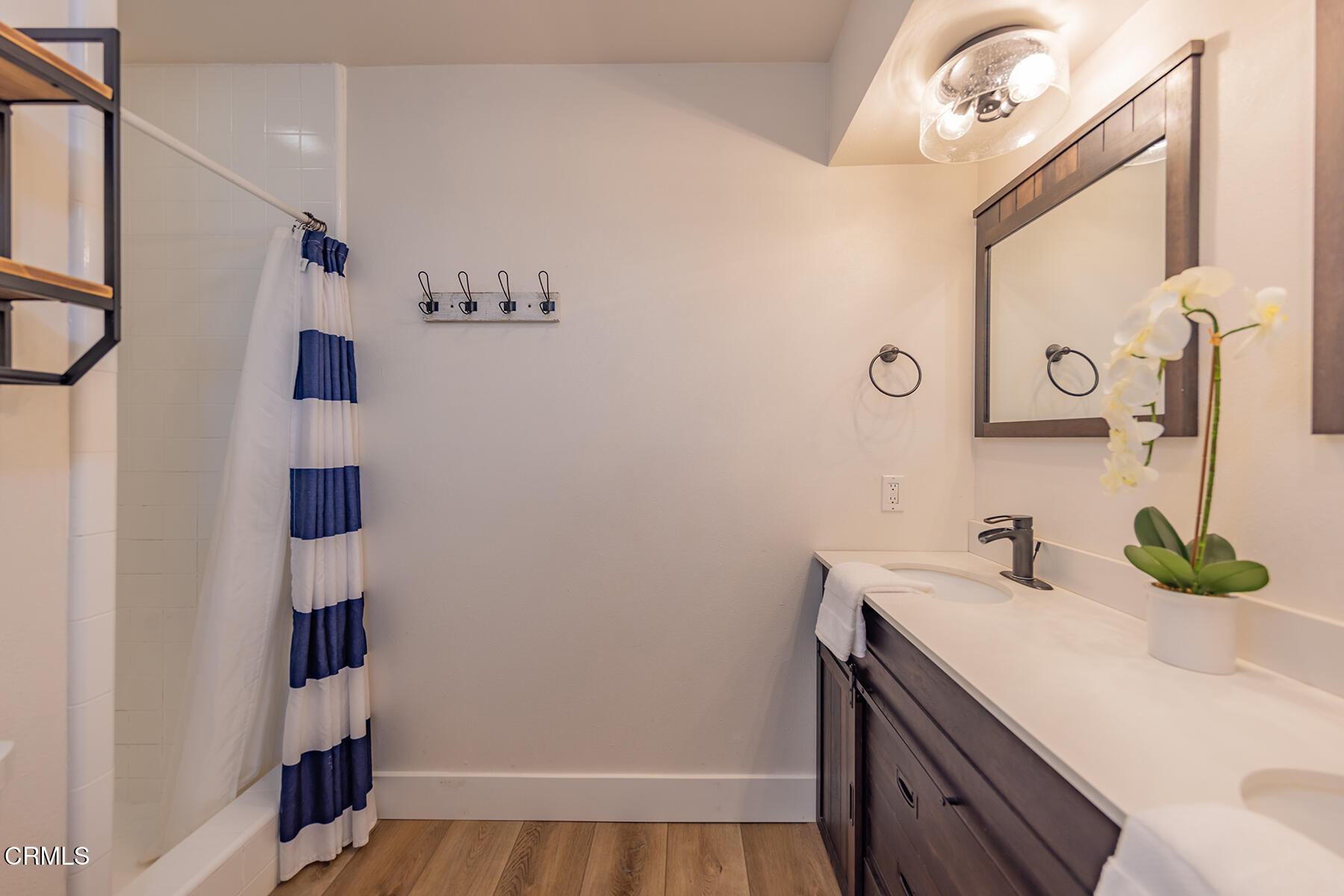 165 Burnham Road Oak View, CA 93022 - Photo 24 of 58 a bathroom with a sink and a mirror