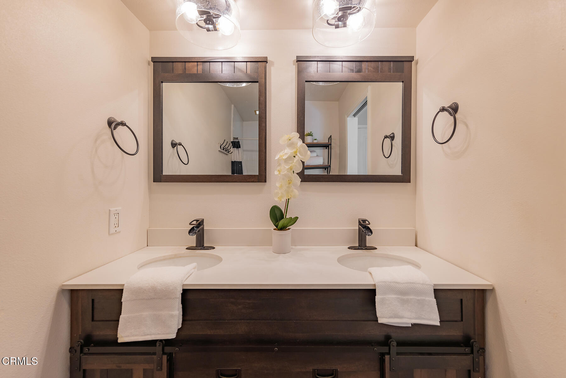 165 Burnham Road Oak View, CA 93022 - Photo 25 of 58 a bathroom with a sink and a mirror
