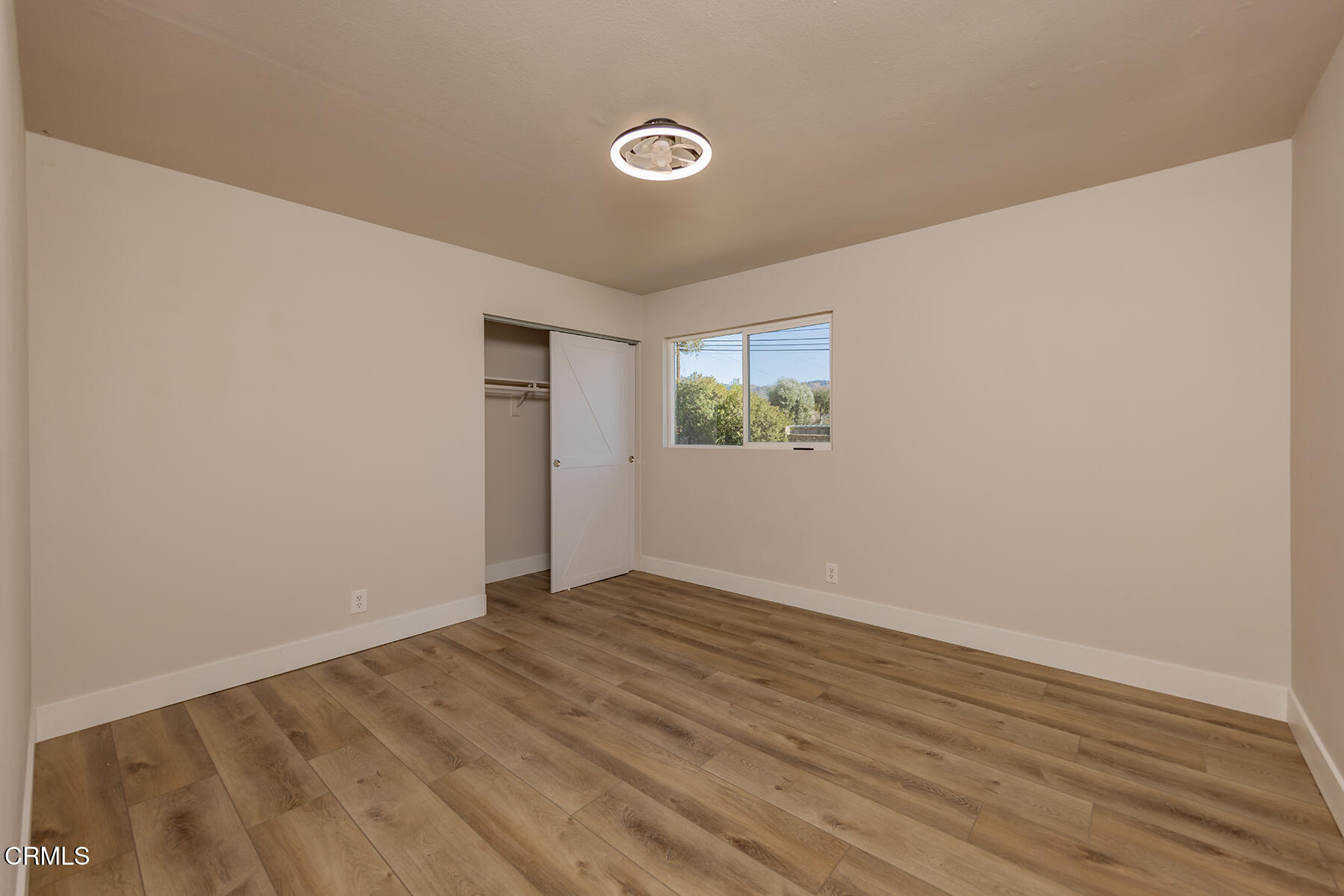 165 Burnham Road Oak View, CA 93022 - Photo 26 of 58 a view of an empty room with wooden floor and a window