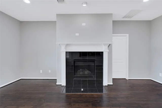 a room with a fireplace and a fireplace