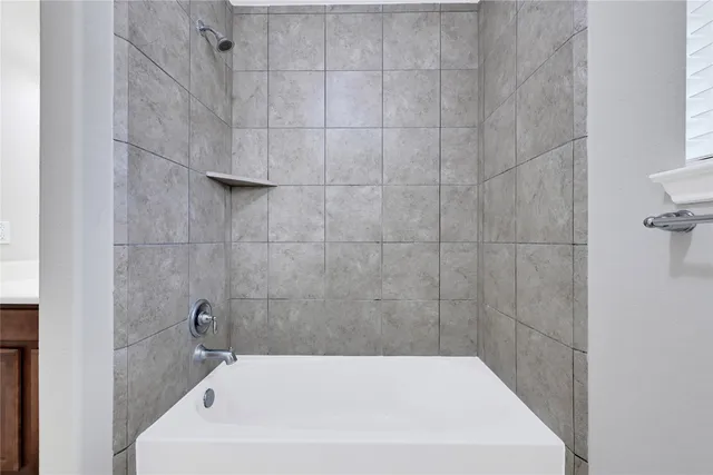 a bathroom with a white bath tub