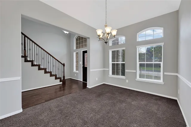 a view of livingroom with hardwood floor and staircase