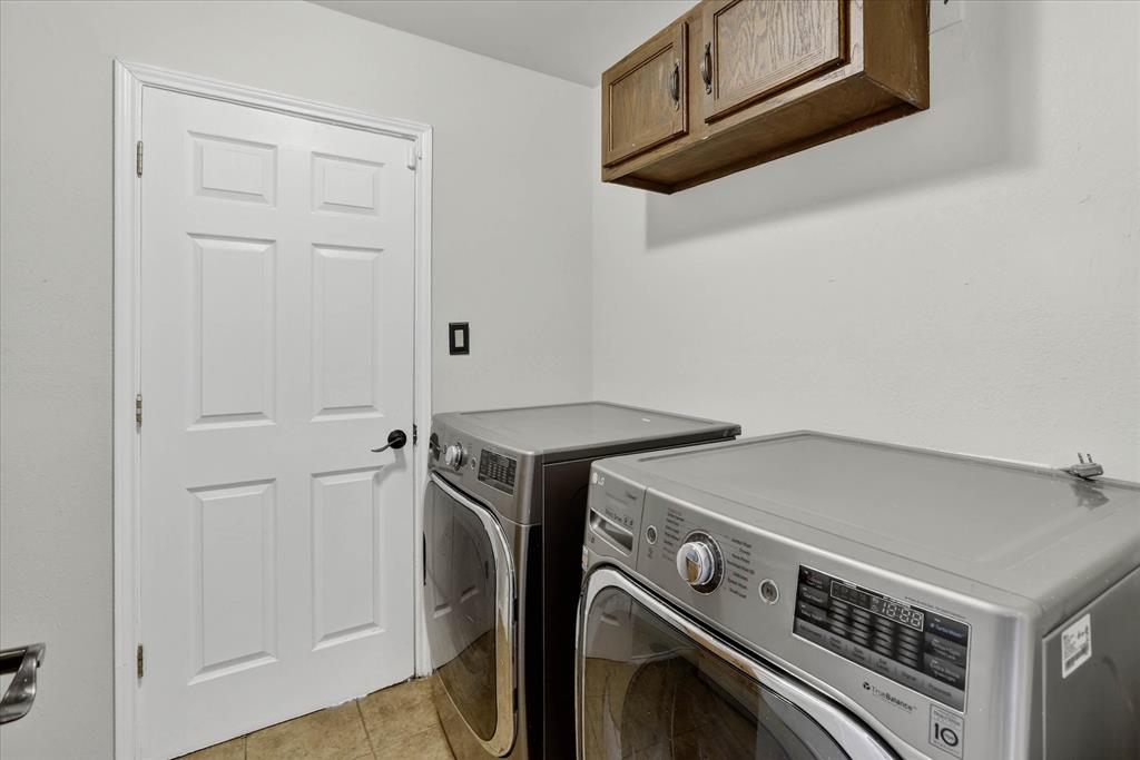 2010 Libby Lane Grand Prairie, TX 75050 - Photo 15 of 24 a utility room with dryer and washer
